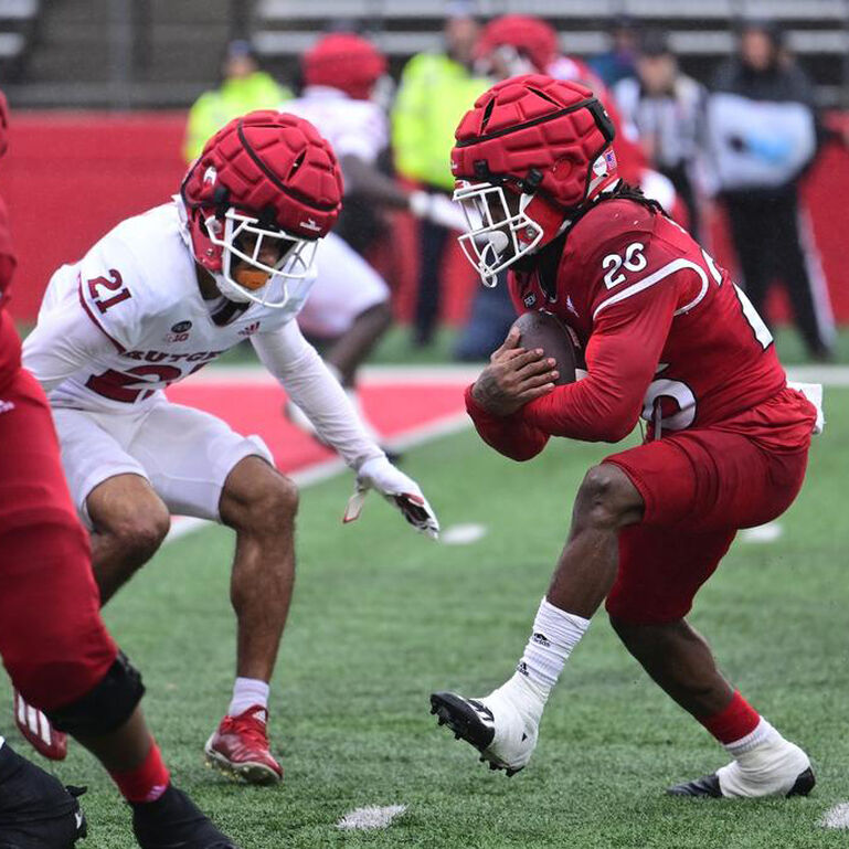 Two Rutgers football team members playing against one another in the annual Spring Game